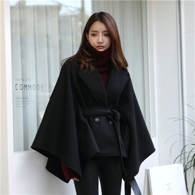 Woman wearing Plus Size Black Winter Poncho Cape Coat in a winter setting