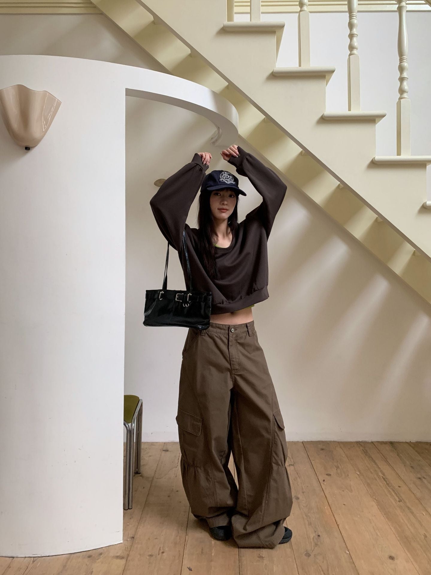 Woman wearing Casual Pleated Cargo Jeans in a casual outdoor setting