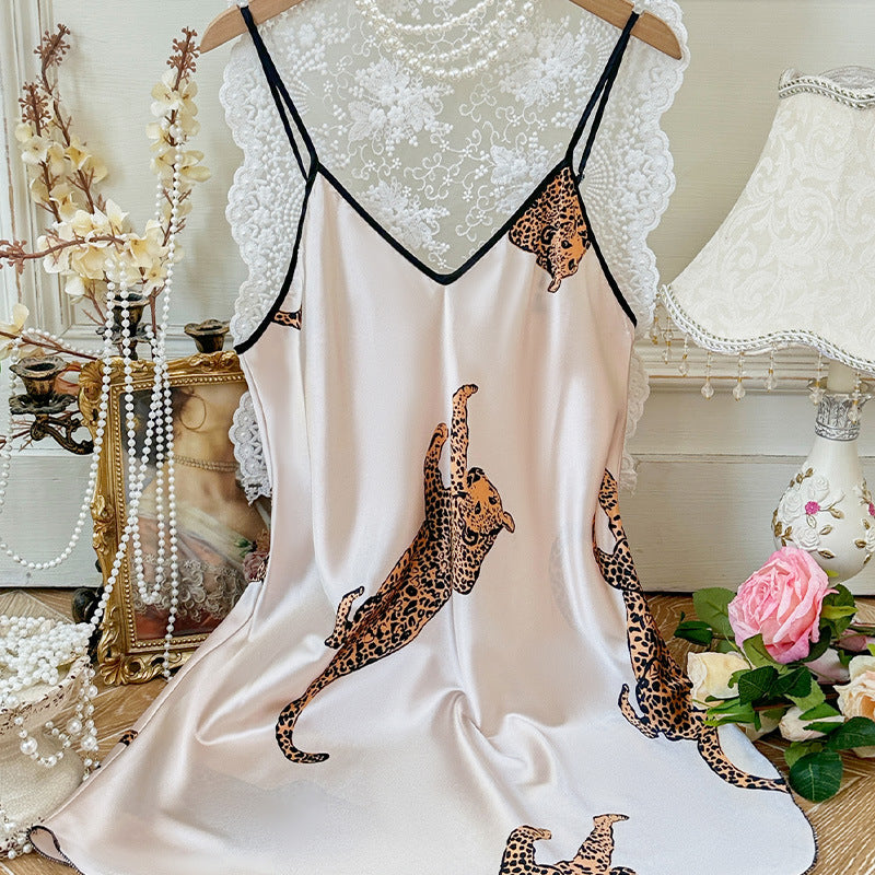 Woman wearing sexy suspender nightgown in a cozy bedroom setting