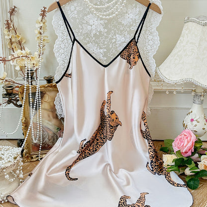Woman wearing sexy suspender nightgown in a cozy bedroom setting