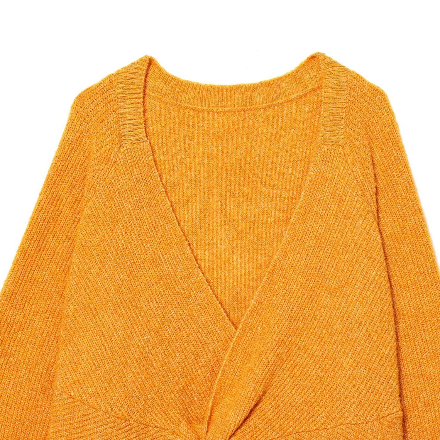 Woman wearing Back Knot Knit Sweater in a cozy setting
