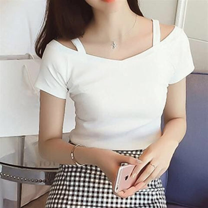 Woman wearing One Shoulder Sleeveless T Shirt in a city setting