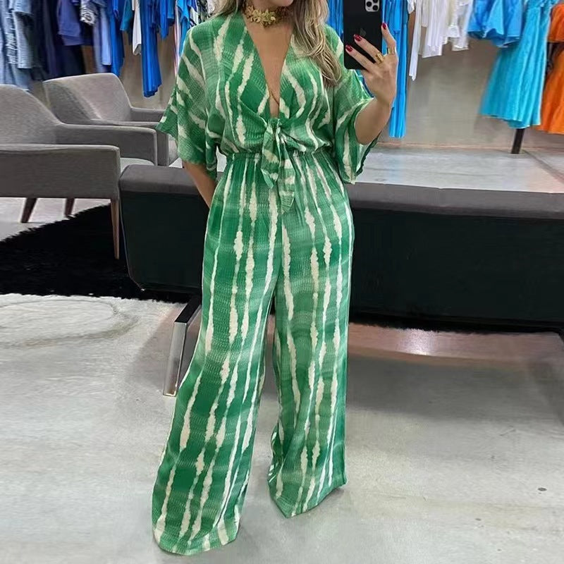 Woman wearing Printed V-Neck Straight Leg Jumpsuit in a casual outdoor setting