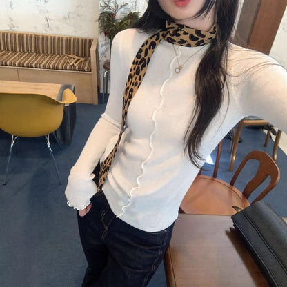 Woman wearing Lace Trim Round Neck Long Sleeve Knit Top in a stylish setting