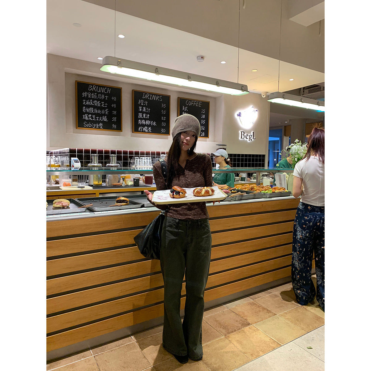 Woman wearing Distressed Flared Jeans with Pockets in a casual setting