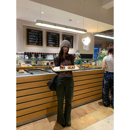 Woman wearing Distressed Flared Jeans with Pockets in a casual setting
