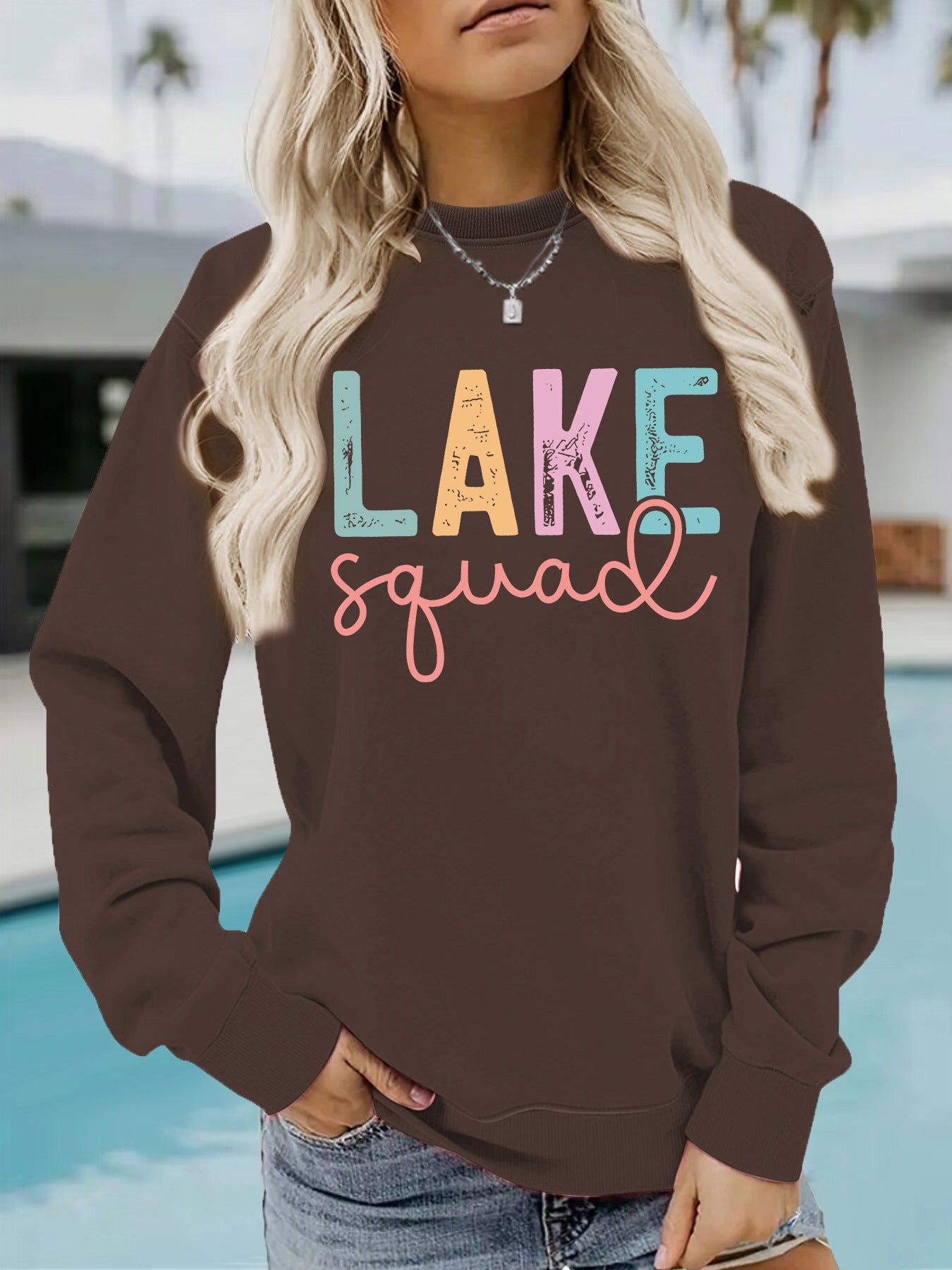 Woman wearing LAKE Printed Hoodie in a casual outdoor setting