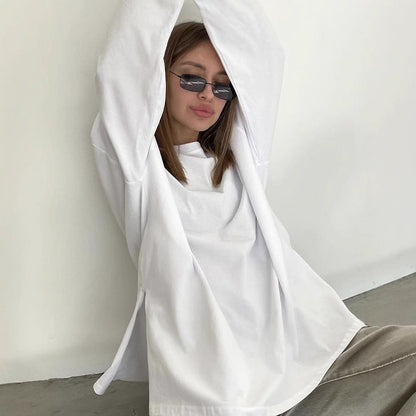 Woman wearing Loose Fit Long Sleeve Slit T-Shirt in a casual setting