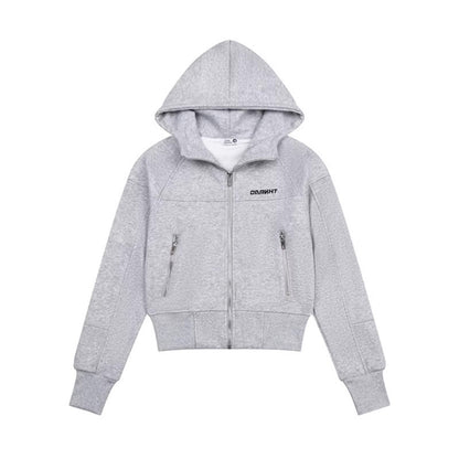 Woman wearing Hooded Sweatshirt with Zipper Pocket in a city setting