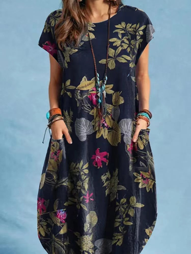 Woman wearing Floral A-Line Cap Sleeve Dress in a garden setting