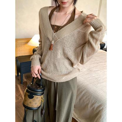 Woman wearing Faux Two-Piece Wool V-Neck Knit Sweater in a casual setting