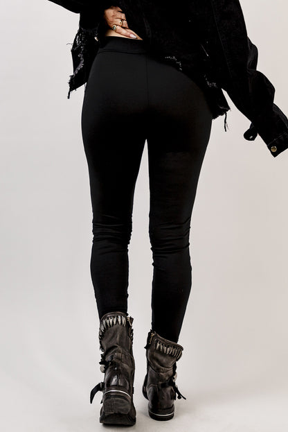 Woman wearing Black Grommet Lace Up Front Leggings in a stylish setting