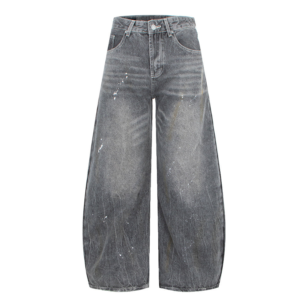 Woman wearing Vintage Washed Gray Splatter Wide Leg Jeans in an urban setting