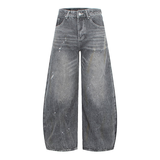 Woman wearing Vintage Washed Gray Splatter Wide Leg Jeans in an urban setting