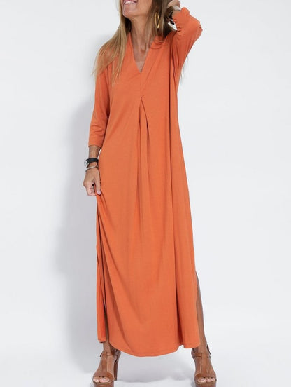 Woman wearing V Neck Three Quarter Sleeve Knit Dress in a stylish urban setting