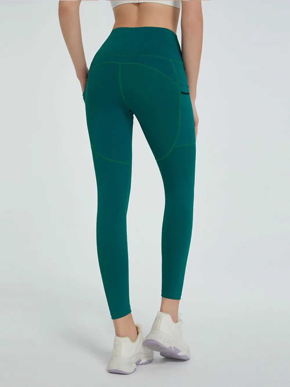 Woman wearing High Waist Active Leggings in a fitness setting