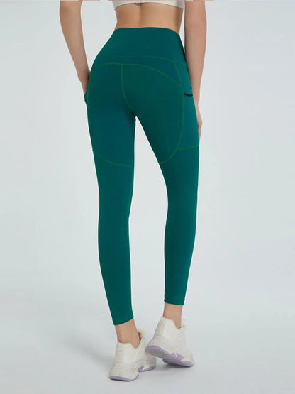 Woman wearing High Waist Active Leggings in a fitness setting
