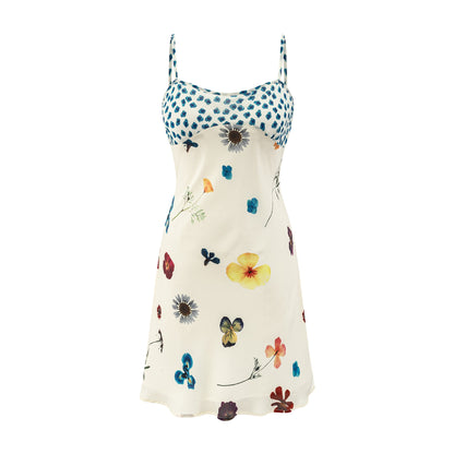 Woman wearing Beige One Shoulder Floral Suspender Dress in a sunny outdoor setting