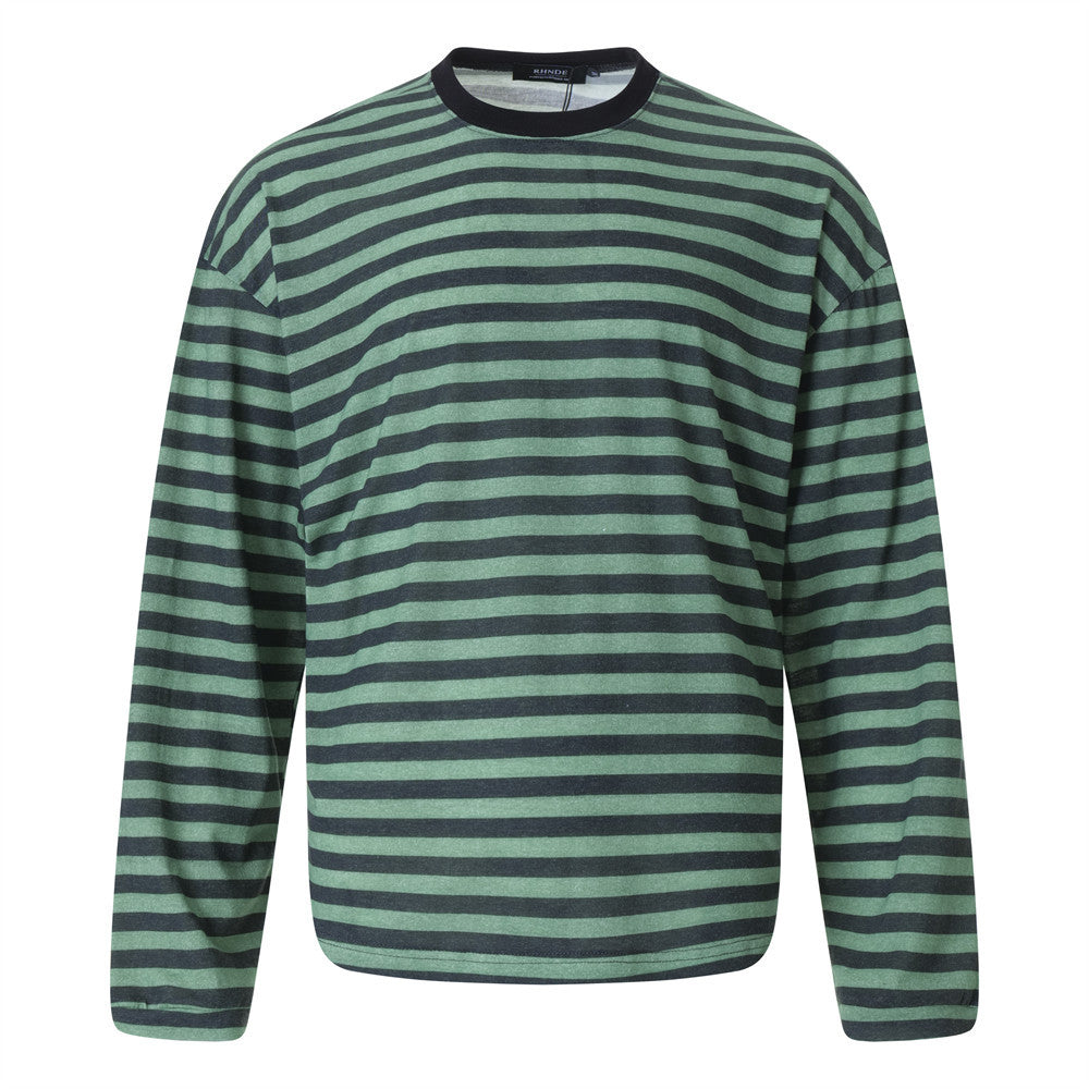 Woman wearing Loose Striped Round Neck Shirt in casual setting