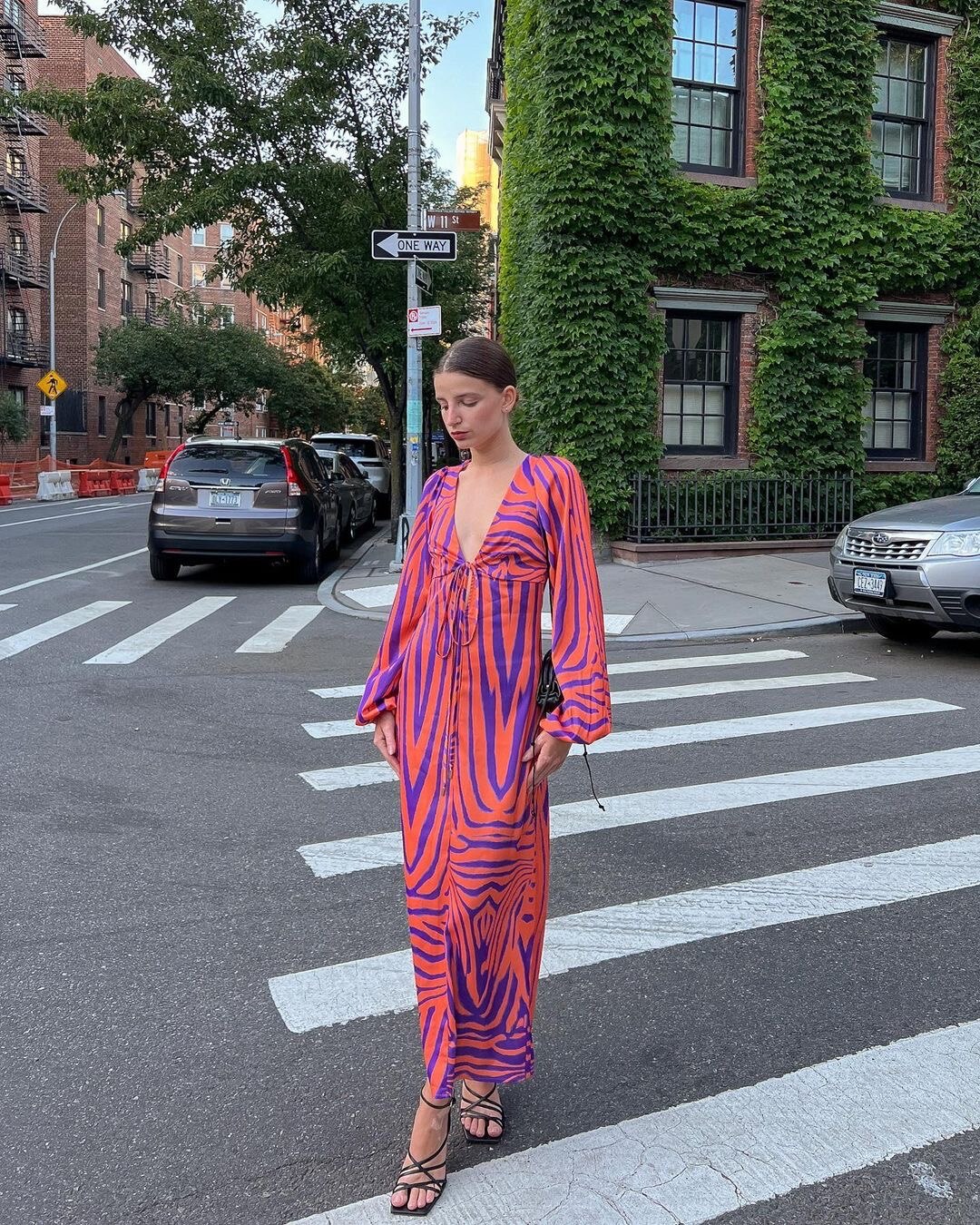Woman wearing Irregular Stripe Printed Long Dress in a stylish urban setting