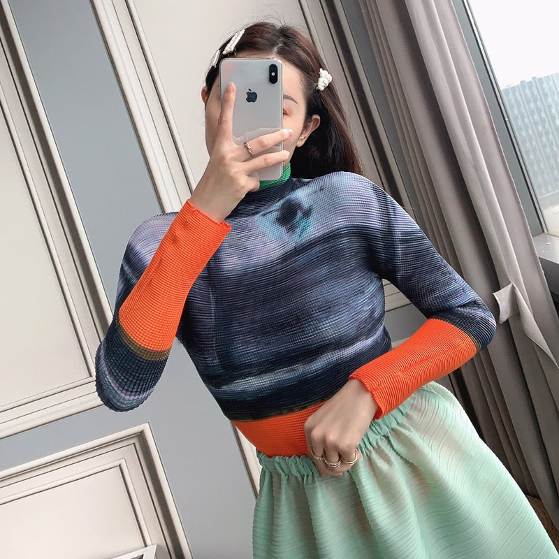 Woman wearing Miyake Pleated Corset Top in a stylish setting