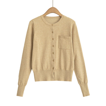 Woman wearing Round Neck Long Sleeve Shirt with Pocket in a casual setting