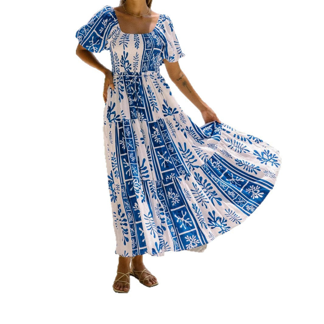 Woman wearing One-Shoulder Puff Sleeve Flared Maxi Dress in a garden setting