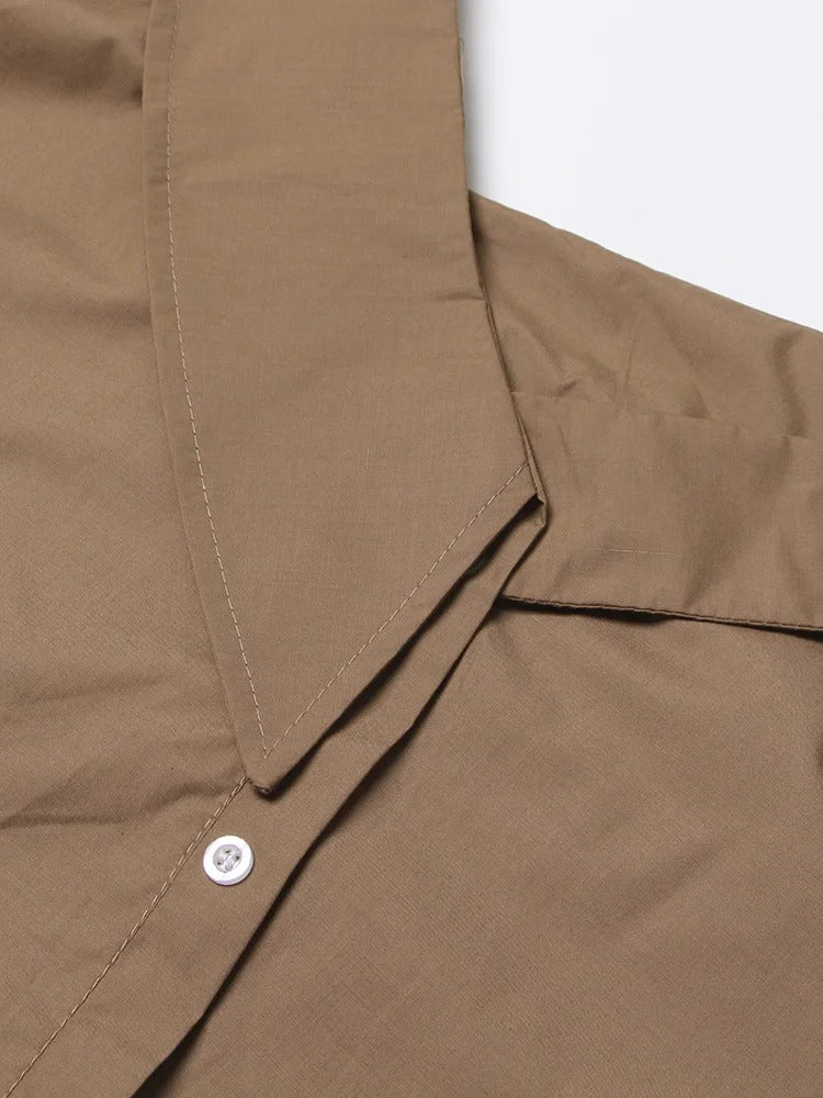 Woman wearing Sleeveless V Neck Lace Up Shoulder Blouse in summer setting