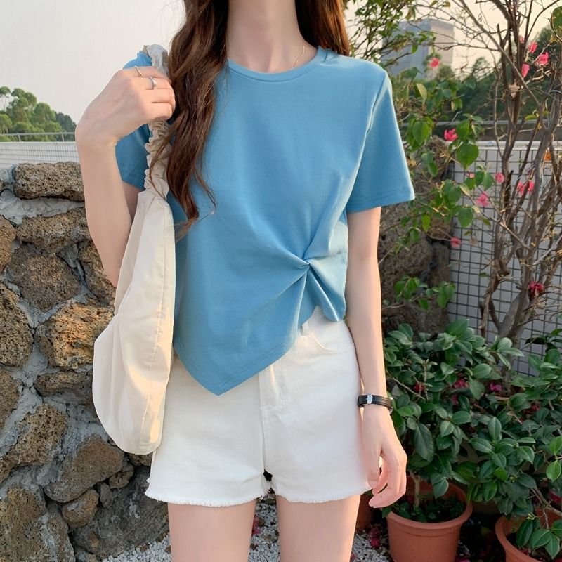 Woman wearing Slim Fit Short Sleeve Crop Top in a casual setting