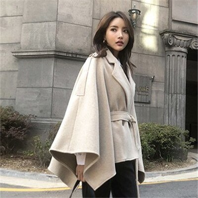 Woman wearing Plus Size Black Winter Poncho Cape Coat in a winter setting