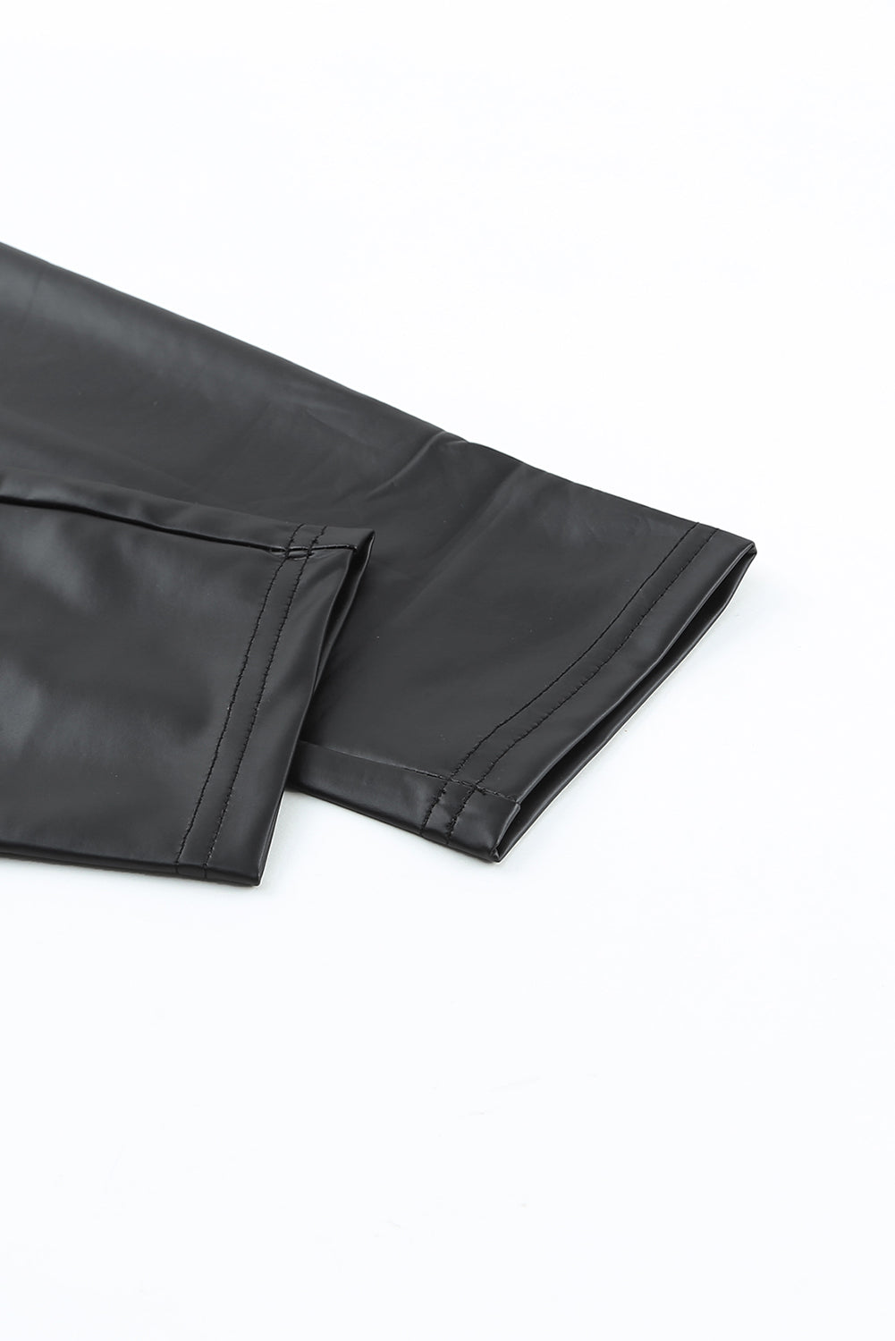 Woman wearing Black Faux Leather High Waist Leggings in a trendy urban setting