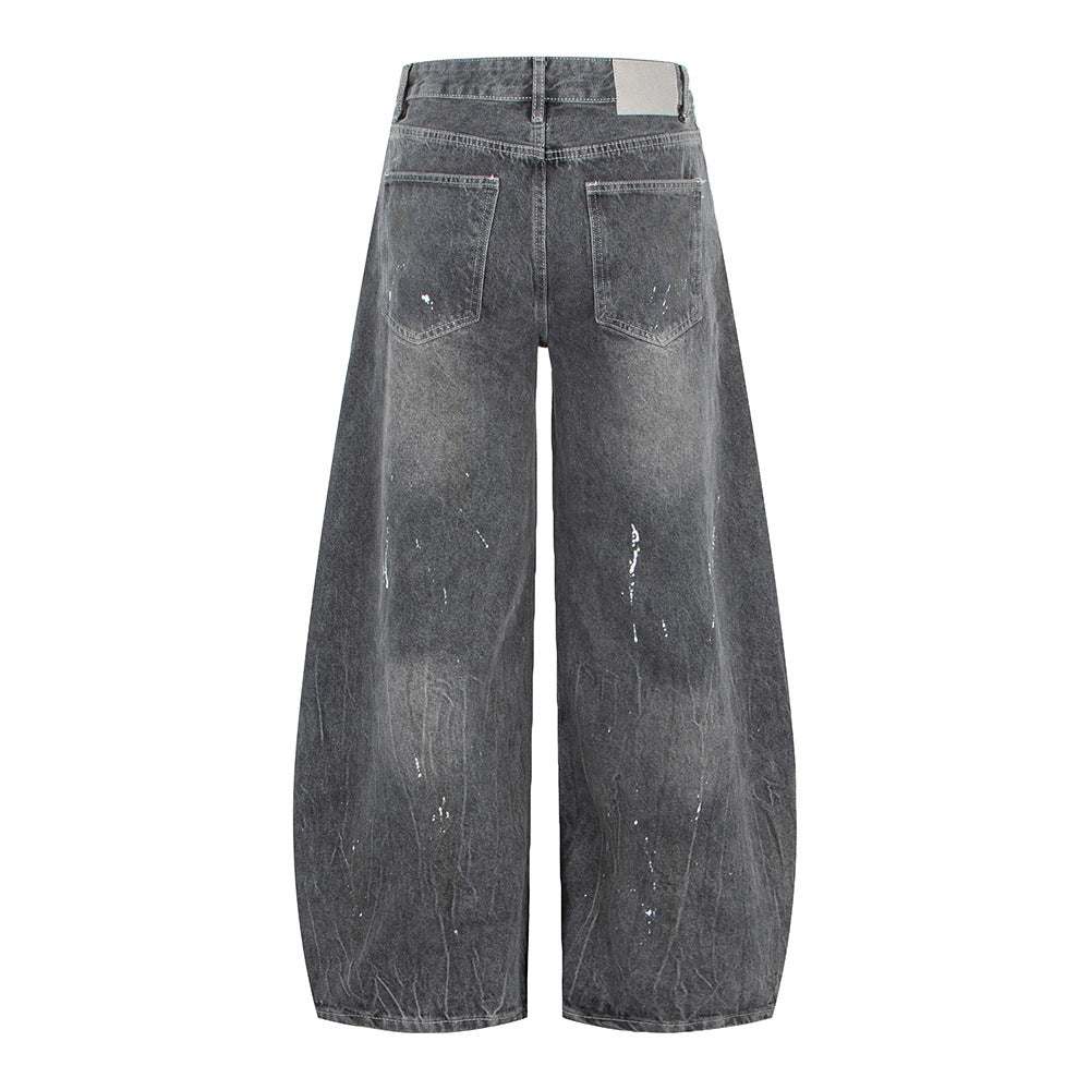 Woman wearing Vintage Washed Gray Splatter Wide Leg Jeans in an urban setting