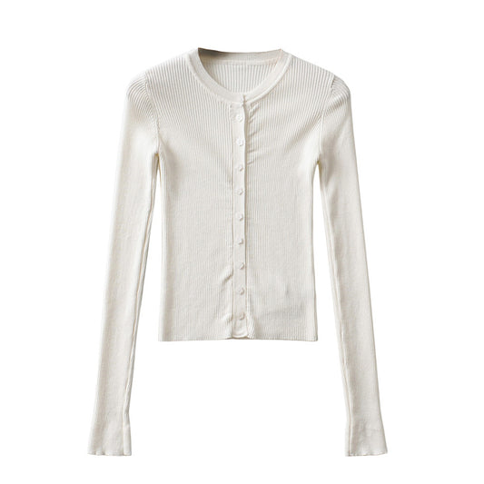 Woman wearing Round Neck Buckle Detail Slim Fit Long Sleeve Top in an office setting