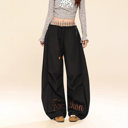 Woman wearing Plaid Patchwork Wide Leg Pants in a casual setting