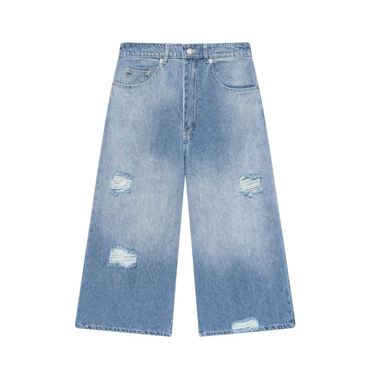Woman wearing Ripped Denim Cropped Pants in a casual urban setting