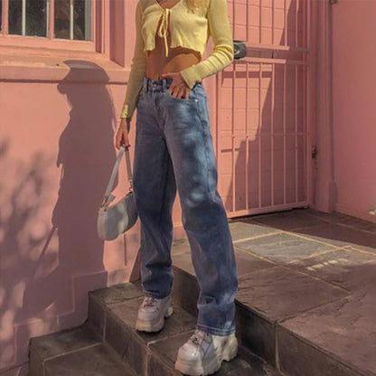 Woman wearing wide leg jeans in a casual outdoor setting