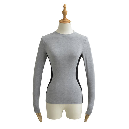 Woman wearing Elastic Slim Fit Color Block Long Sleeve T-Shirt in a casual setting