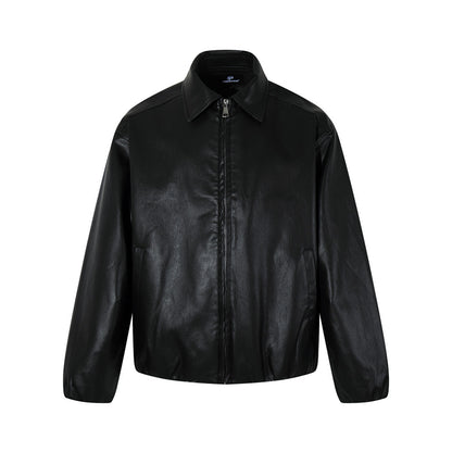 Woman wearing sleek PU leather zip-up jacket in an urban setting