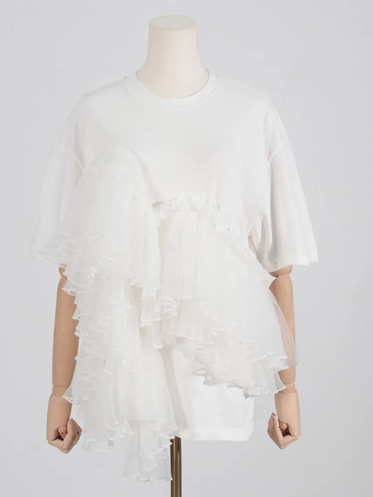 Woman wearing Cotton Mesh Patchwork Loose O Neck Short Sleeve T Shirt in a casual setting