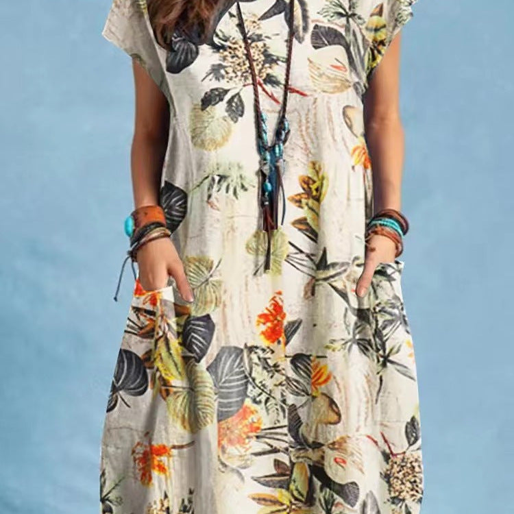 Woman wearing Floral A-Line Cap Sleeve Dress in a garden setting