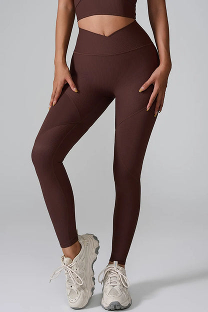 Woman wearing High Waist Active Leggings in a gym setting