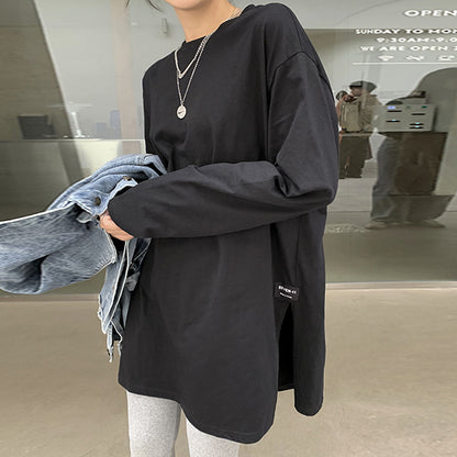 Woman wearing Solid Color Side Slit Long Sleeve T-Shirt in a casual setting
