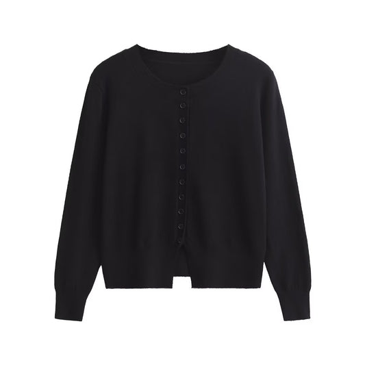 Woman wearing Round Neck Multi-Button Long Sleeve Top in a stylish setting