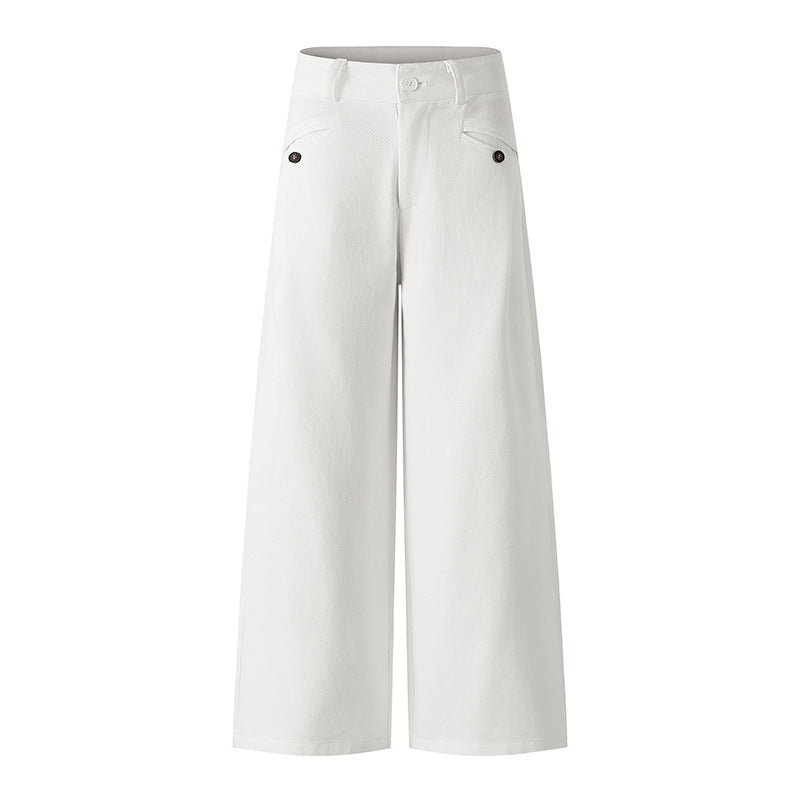 Woman wearing casual white denim pants in a trendy urban setting