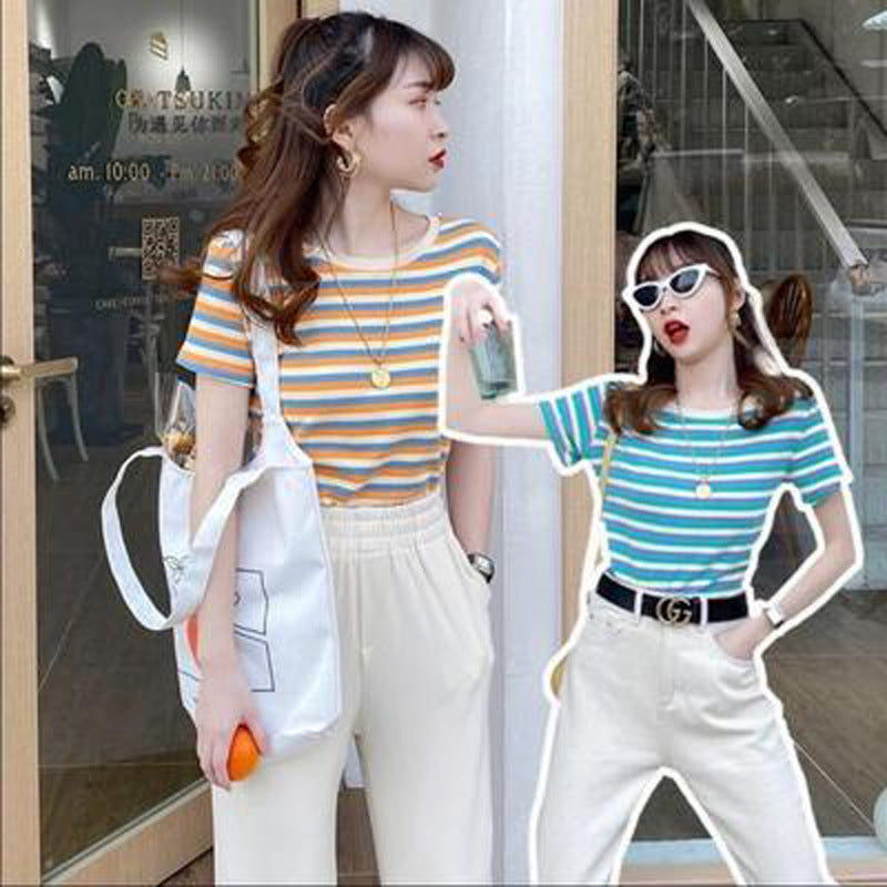 Woman wearing Women’s Stripe Short Sleeve Slim Fit Casual Top in a casual setting