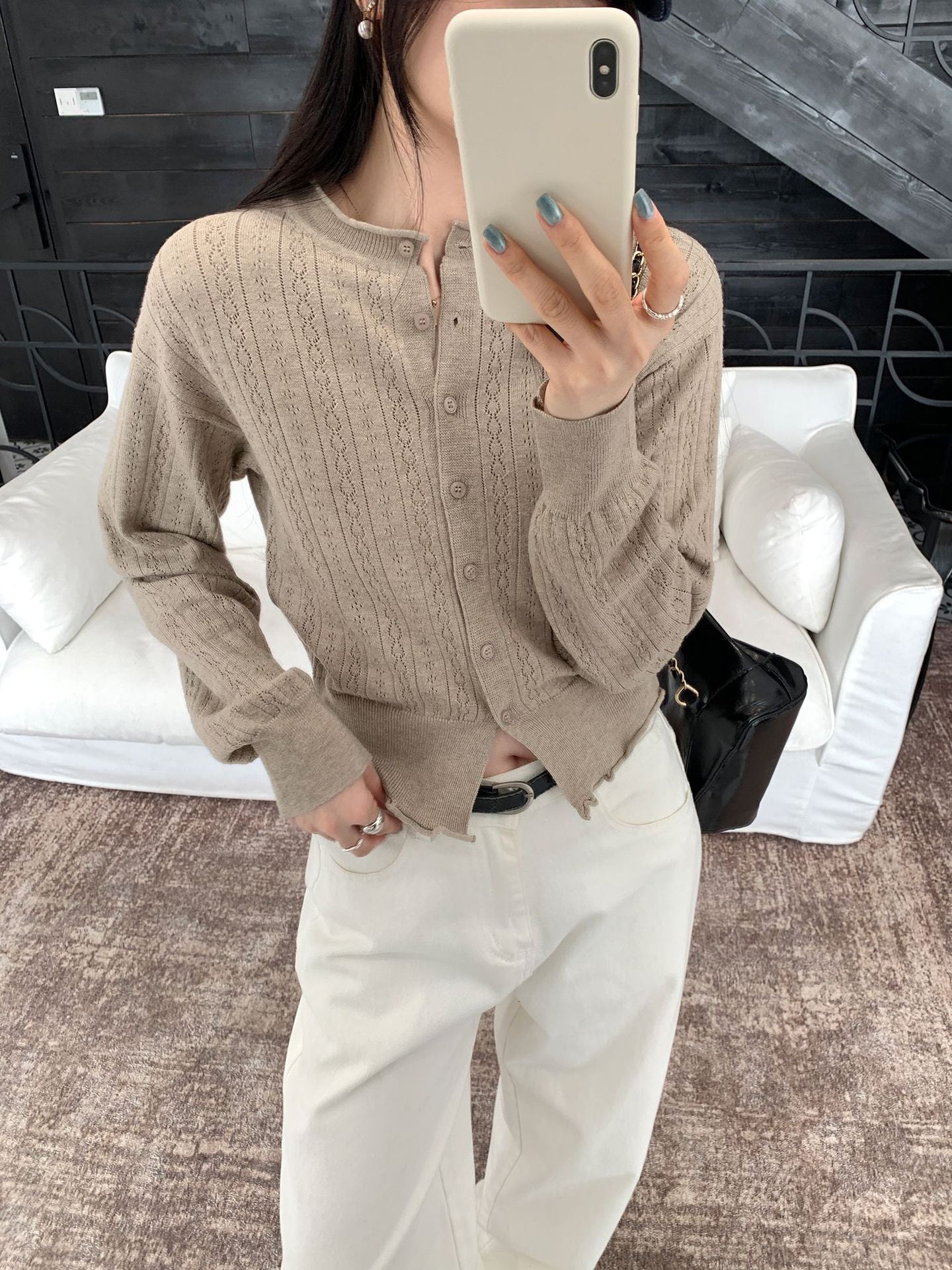 Woman wearing Hollow-Out Knit Cardigan Coat in casual setting