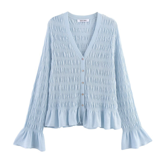 Woman wearing Light Blue Pleated Knitted Jacket in a casual setting