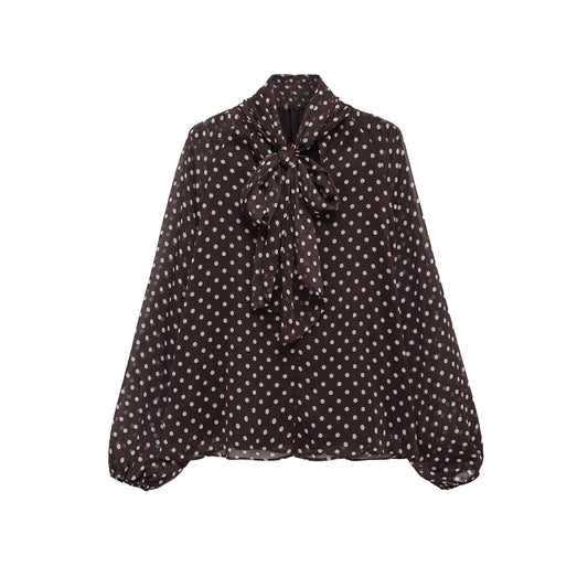 Woman wearing Bow Knot Polka Dot Long Sleeve Shirt in a casual setting