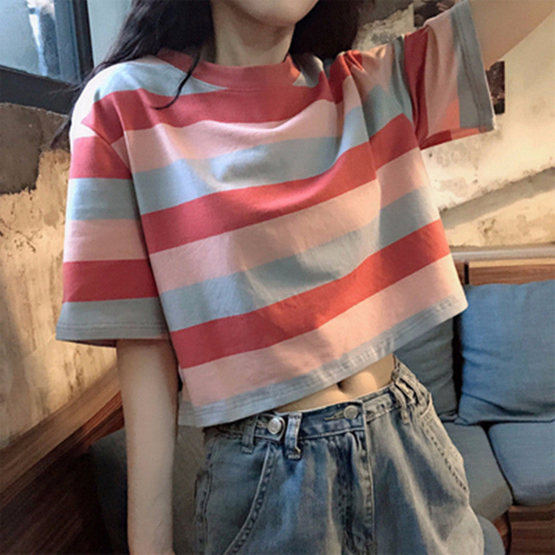 Woman wearing Loose Rainbow Striped Crop Top in a sunny park