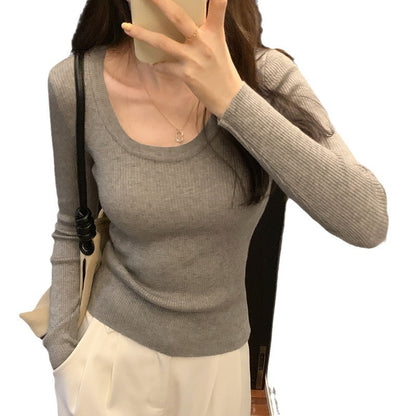 Woman wearing U Neck Long Sleeve Pullover Top in a casual setting